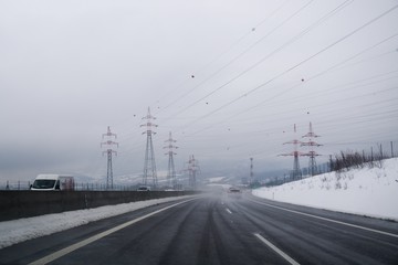 Fototapeta na wymiar Povazska Bystrica, Slovakia - January, 2018: Highway during snowfall. Slovakia