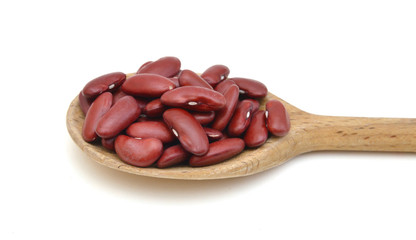 Red kidney beans isolated in wood spoon on white background