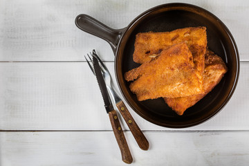 Pieces of cod in breadcrumbs.