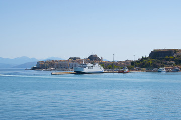 Panoramic view of Corfu island from water. Castle and old town