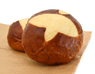 Two roll breads isolated on brown paper