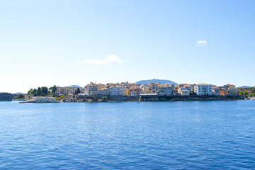 Fototapeta premium Panoramic view of Corfu island from water. Castle and old town