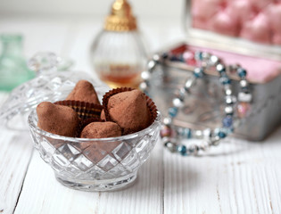 Homemade chocolate truffles with mint sprinkled with cocoa powder, selective focus