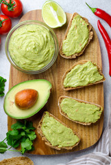 Homemade guacamole with sliced bread