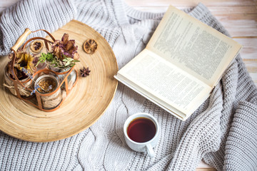 book with a cup of coffee on the bed in the home interior