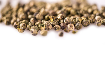 detail close up whole peppercorn on white background