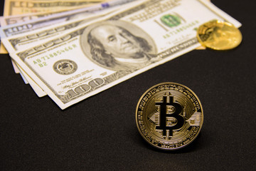 Bitcoin with dollars and golden coin