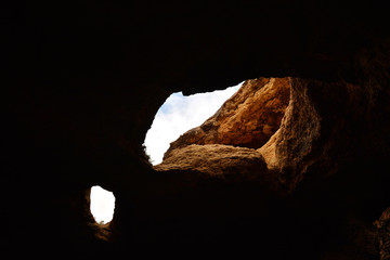 The interior of a sea cave on the Algarve coast near Benagil, Portugal, Europe. Nature geology seen from boat trip.