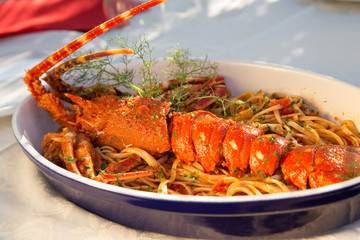 Lobster with pasta cooked in mediterranean style, restaurant Croatia.