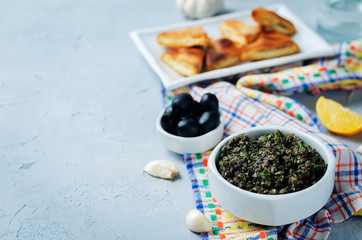 Fototapeta na wymiar Black Olive Tapenade with roasted pita