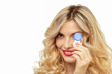 Beautiful blond woman with contact lenses box.