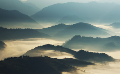 silhouettes of mountains. autumn morning in the Carpathian mountains. foggy dawn