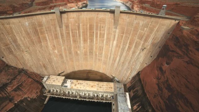 a zoom in front on shot of glen canyon dam and power station in page, arizona
