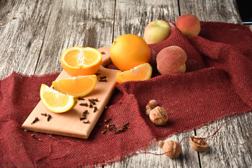 oranges, peaches and cookies on a table