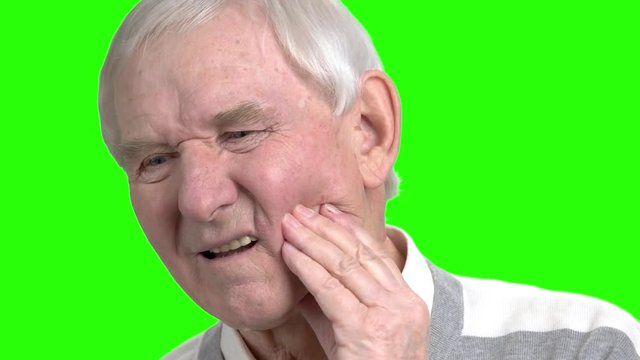 Senior man suffer from teeth disease. Pain from pulpitis disease.