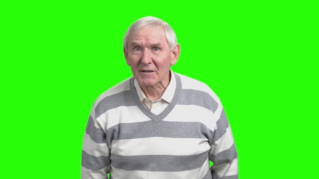 Grandpa scolding you. Angry senior man scolding and gesturing with his finger pointing at you, hromakey background.