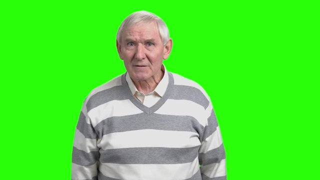 Angry old man with frown face blames you. Grandpa rebuke reproach, hromakey backgrund.