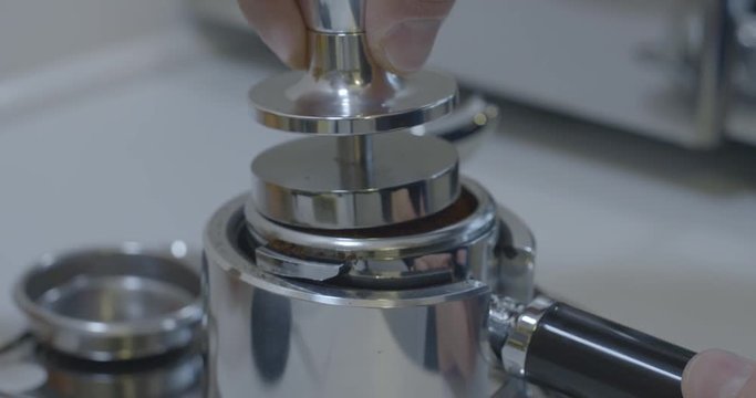 Coffee Barista Tamping The Coffee For A Shot Of Espresso 