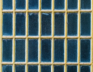 Abstract beautiful photograph of blue glass windows, with yellow frames