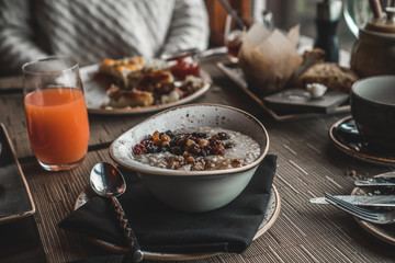 a country breakfast with oatmeal and dried fruit