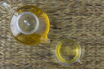Herbaltea in a Teapot and glas cup