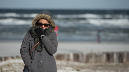 Woman standing at Ocean in Freezing weather © David