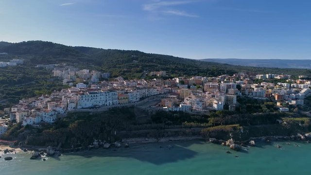 16261_Aerial_shot_of_the_white_apartment_buildings_in_the_coastal_town_in_Italy.mov