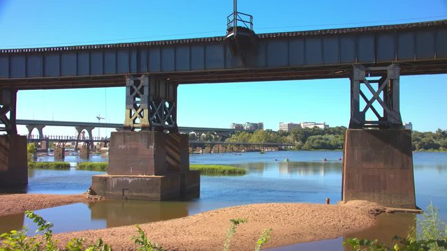 Recreational Nature Scene Under the James River Bridges of Richmond VA with People Kayaking on a Sunny Day in the Virginia Commonwealth Capital City