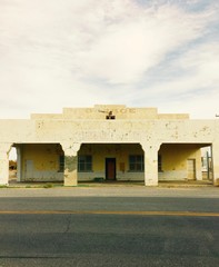 Fototapeta na wymiar Abandoned petrol gas station on a desert road in Death Valley California