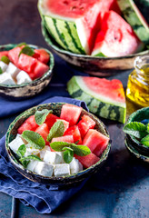 Watermelon cheese and mint salad with olive oil. Close up