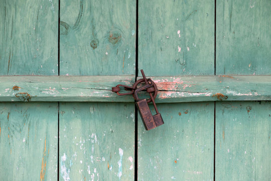 Korean traditional, closed green doors and locks of old technology