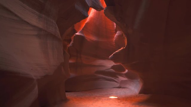 the sun shines on the floor of upper antelope canyon in page, arizona