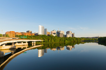 Washington DC panorama along Potomac River in an early morning, USA. Urban landscape in late spring with bridges and modern skyscrapers.
