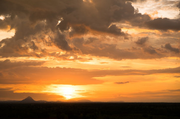 Fototapeta na wymiar Sunset / sunrise with vivid magenta sky, clouds and mountains dark silhouettes
