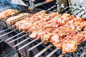 Raw shish kebab is fried on charcoal
