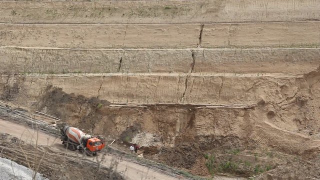 a car goes on the road\a car with concrete goes on the road to the quarry