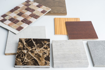 samples of material, wood , color ,ceramic , on wooden table on white background .Interior design...