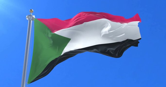 Flag of Sudan waving at wind in slow in blue sky, loop