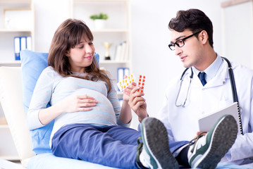 Pregnant woman visiting doctor for consultation
