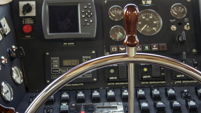 Steering wheel and instrument panel in a motor yacht cockpit