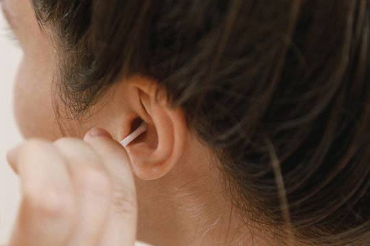 Cleaning Ear With A Cotton Swab