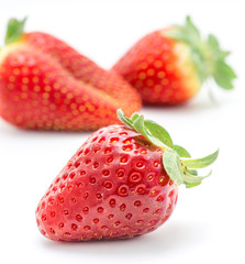 ripe strawberries isolated on white