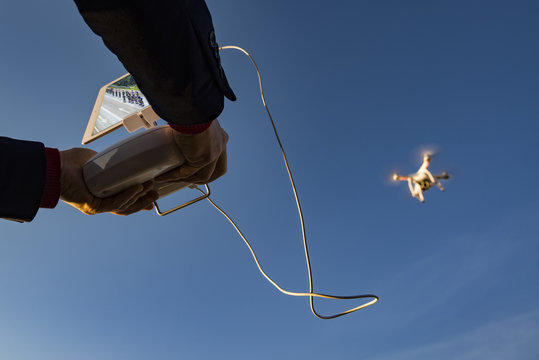 Drone flight remote controller in man hands