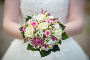 Obraz na płótnie Canvas Beautiful Wedding Bouquet In Bride's Hands