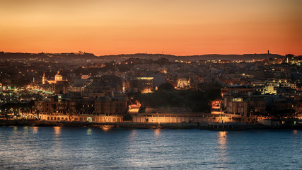 Malta: Il-Gzira and Marsans Harbour. Aerial view from city walls of Valletta at sunset