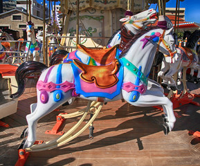 Colorful vintage carousel with horses