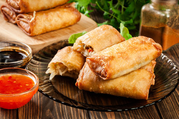 Spring rolls with chicken and vegetables served with sweet chili sauce or soy sauce