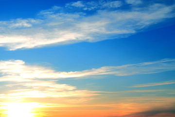 Background blue sky and clouds at sunset.