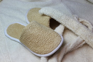 Fototapeta na wymiar Bath slippers and bathrobe