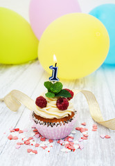 Cupcake with a numeral one candle